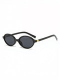 Black sunglasses with gold accents on a white background