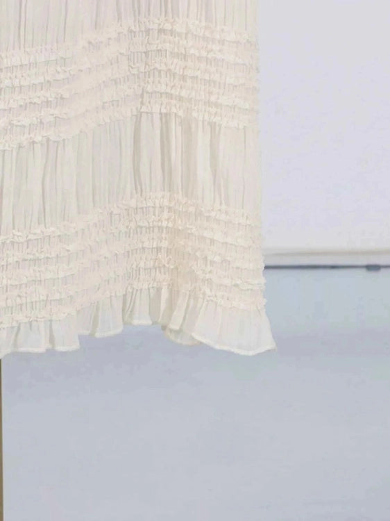 White textured fabric on a light blue background