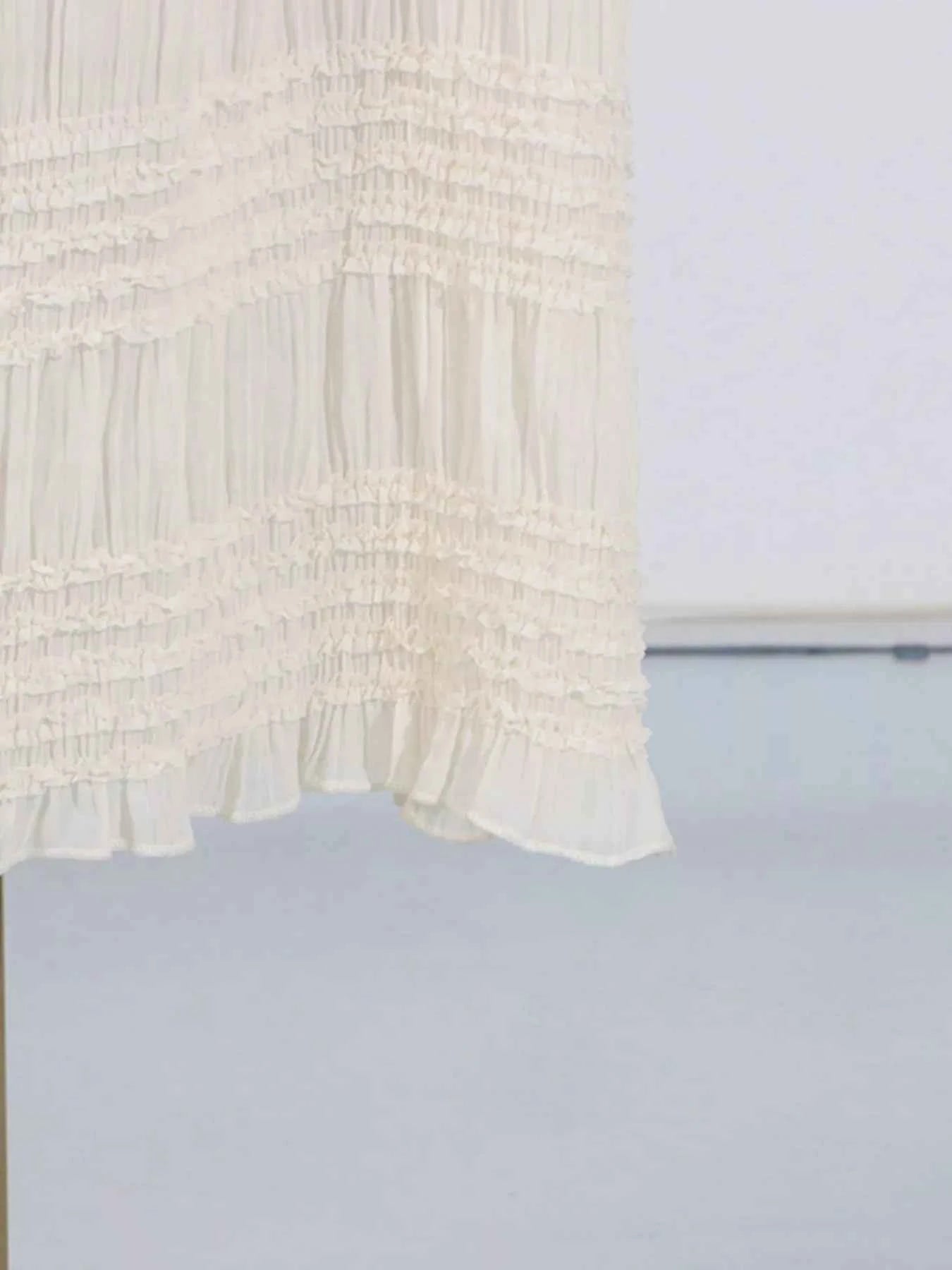 White textured fabric on a light blue background