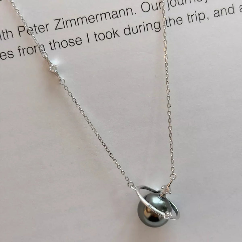 Silver necklace with a pendant on a white background