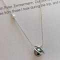 Silver necklace with a pendant on a white background