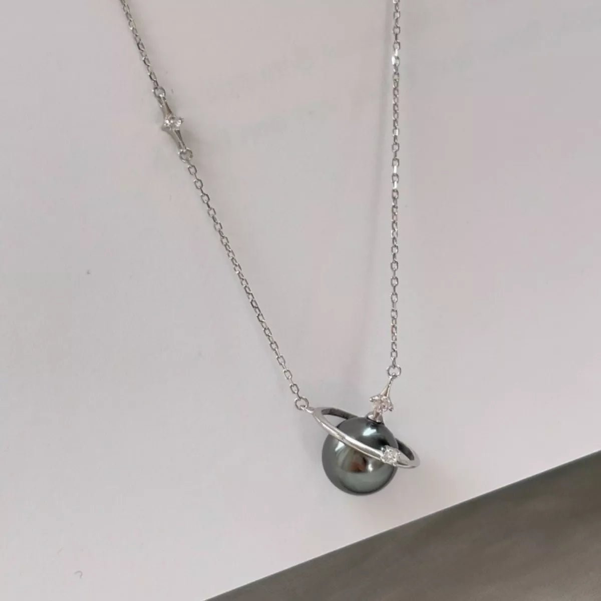 Necklace with a unique pendant on a plain background