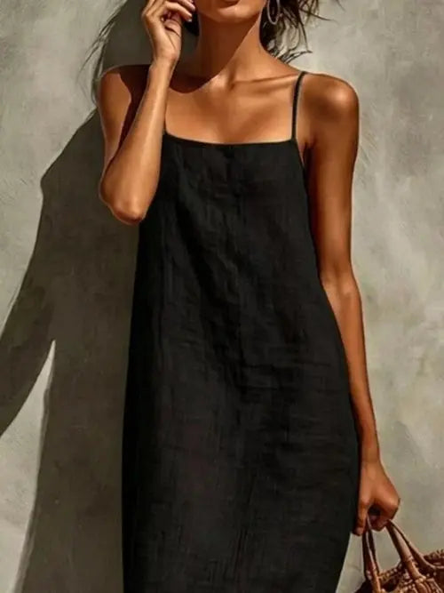 Close-up of black square neck sleeveless maxi dress showing woven texture