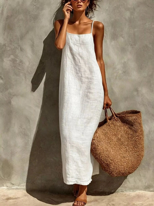 White sleeveless square neck maxi dress with loose straight fit and sandals