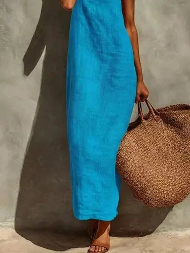 Side view of turquoise blue straight hem maxi dress with thin straps