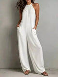 White sleeveless wide leg jumpsuit front view with side pockets