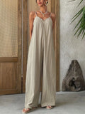 Effortless elegance meets comfort in this sleeveless wide leg casual jumpsuit, embodying a refined boho aesthetic with radical authenticity. Designed for versatile styling, the relaxed silhouette flatters all body types while the breathable fabric keeps you cool throughout the day. The wide leg cut offers a modern, sophisticated look that transitions seamlessly from day to night—perfect for weekend outings, casual brunches, or layered styling with your favorite accessories. Pair with sandals for a laid-bac.