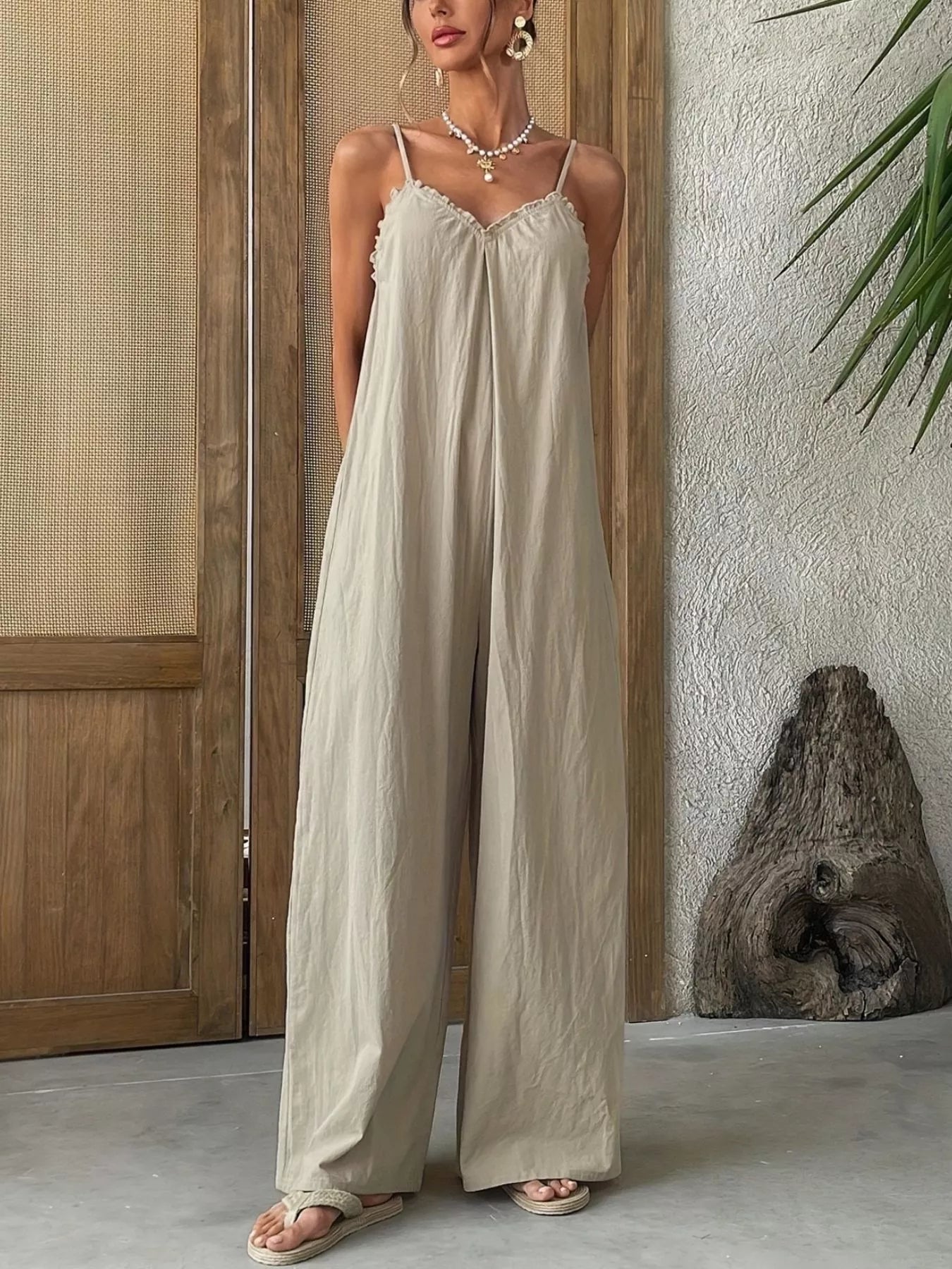 Effortless elegance meets comfort in this sleeveless wide leg casual jumpsuit, embodying a refined boho aesthetic with radical authenticity. Designed for versatile styling, the relaxed silhouette flatters all body types while the breathable fabric keeps you cool throughout the day. The wide leg cut offers a modern, sophisticated look that transitions seamlessly from day to night—perfect for weekend outings, casual brunches, or layered styling with your favorite accessories. Pair with sandals for a laid-bac.