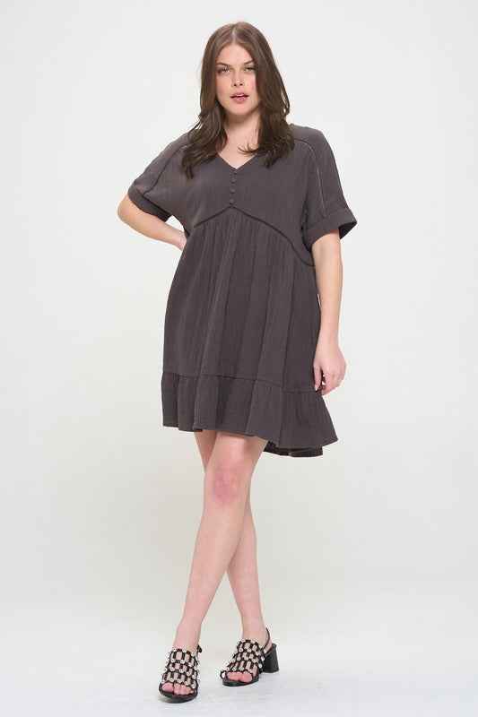Woman wearing a gray dress on a white background