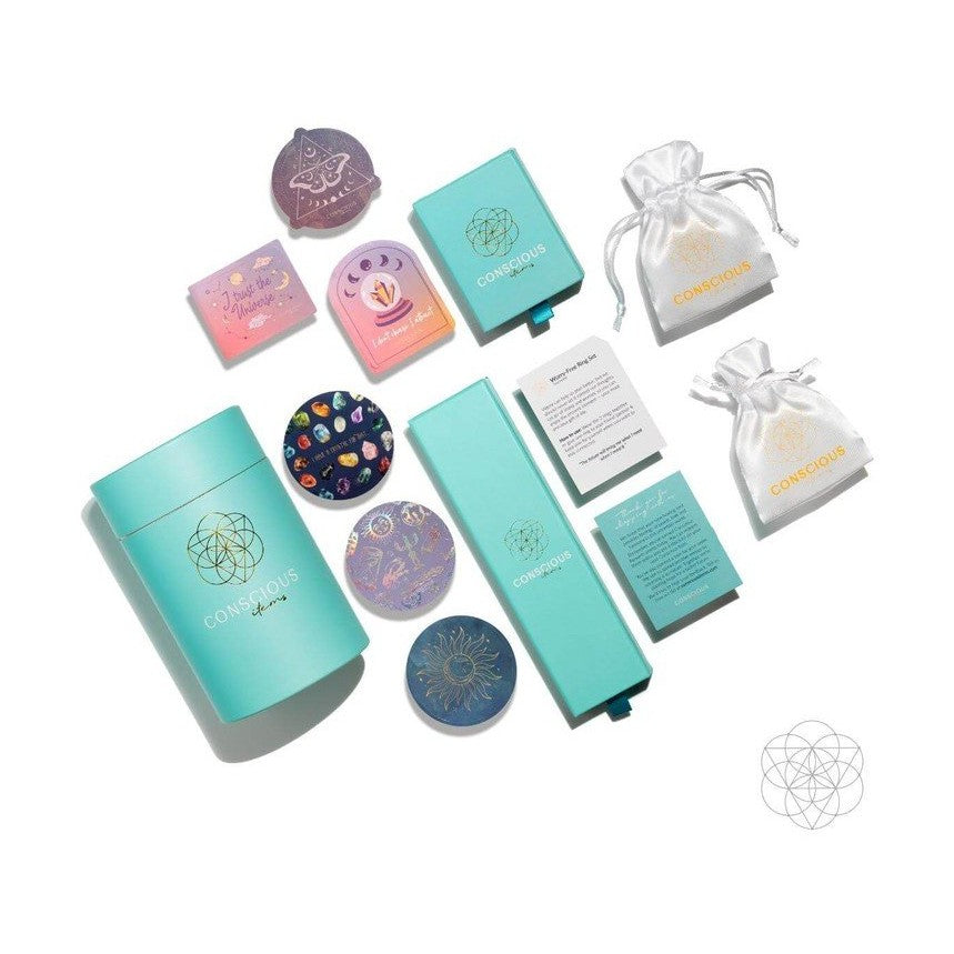Conscious Items packaging set including teal boxes, silk pouches, and celestial cards