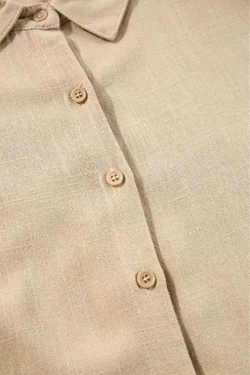 Close-up of a beige shirt with buttons
