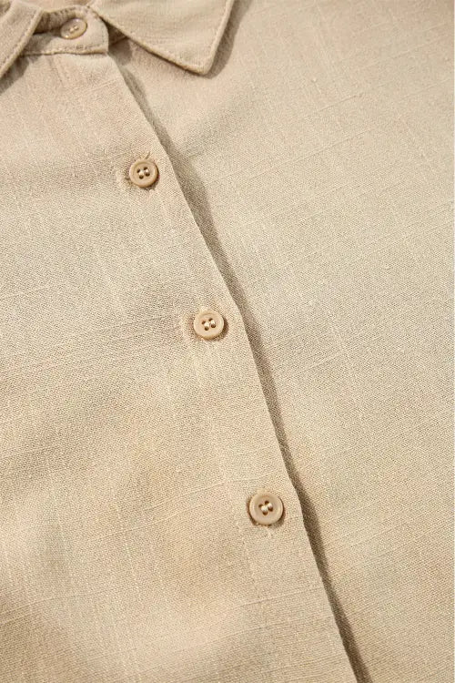 Close-up of a beige shirt with buttons