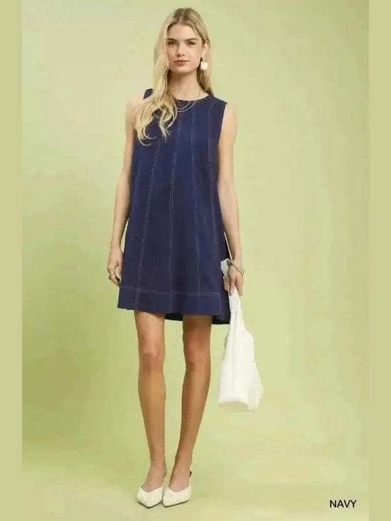 Navy linen swing dress styled with white textured tote bag