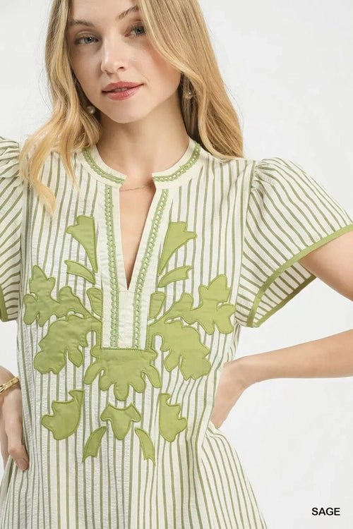 Umgee Stripe Midi Dress with Lace Trim - Salty Season LLC Woman wearing a green and white dress with floral embroidery on a white background