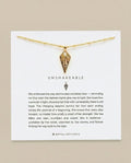 Gold Unshakeable necklace card featuring moon star symbols and brand logo