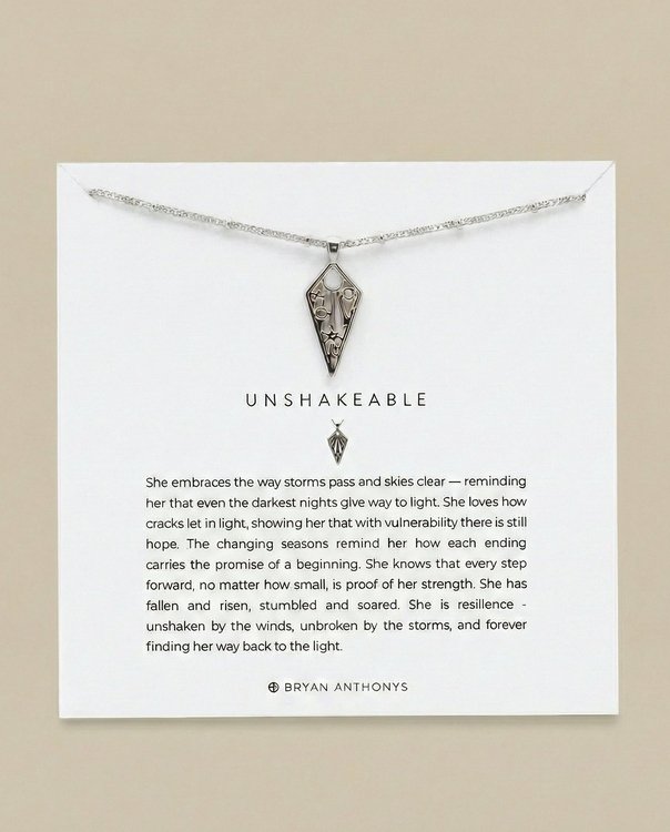Silver Unshakeable necklace card with moon star symbols and engraved text