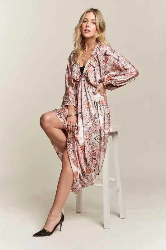 woman on white stool in pink dress