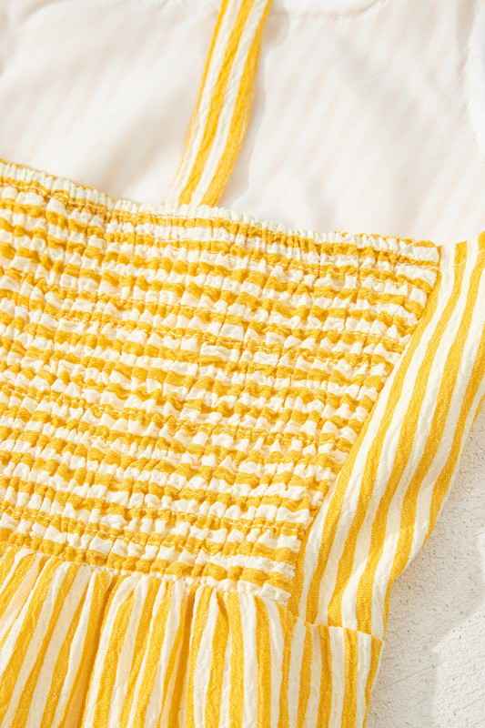 Close-up of a yellow and white striped fabric with a textured pattern.