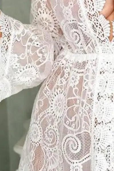 Close-up of white lace fabric with intricate patterns